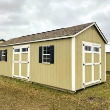 Beige Garden Shed Max with white trim and black shutters