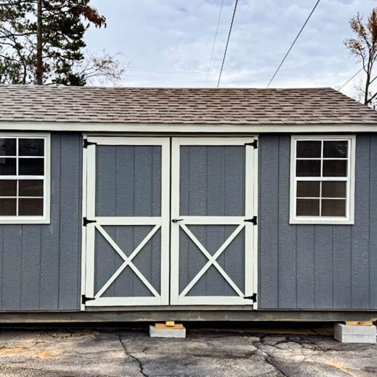 Gray 12x16 Utility shed with silver maple trim and barn-style doors ( with X detail )