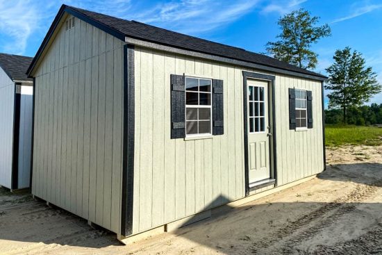 beige 12x20 Garden Shed Max with black window shutters and a single entry 9 lite door