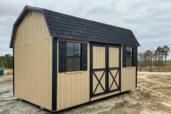 Exterior view of a beige and black 10x16 Garden Shed Max in Bonaire GA with barn-style double doors