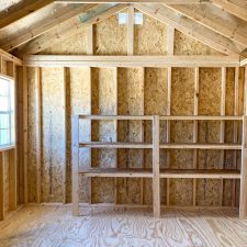 12x16 Garden Shed Max interior view with expose wood and built-in shelves