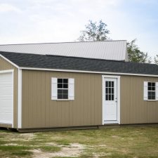 A custom storage shed garage in Georgia with white doors