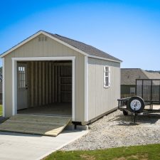 A custom storage shed garage in Georgia with a wooden ramp