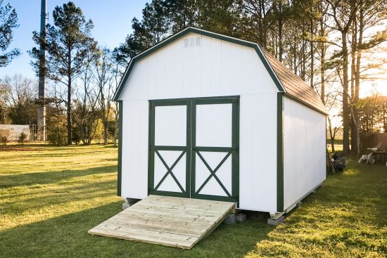 A custom lofted storage shed in Georgia at sunset