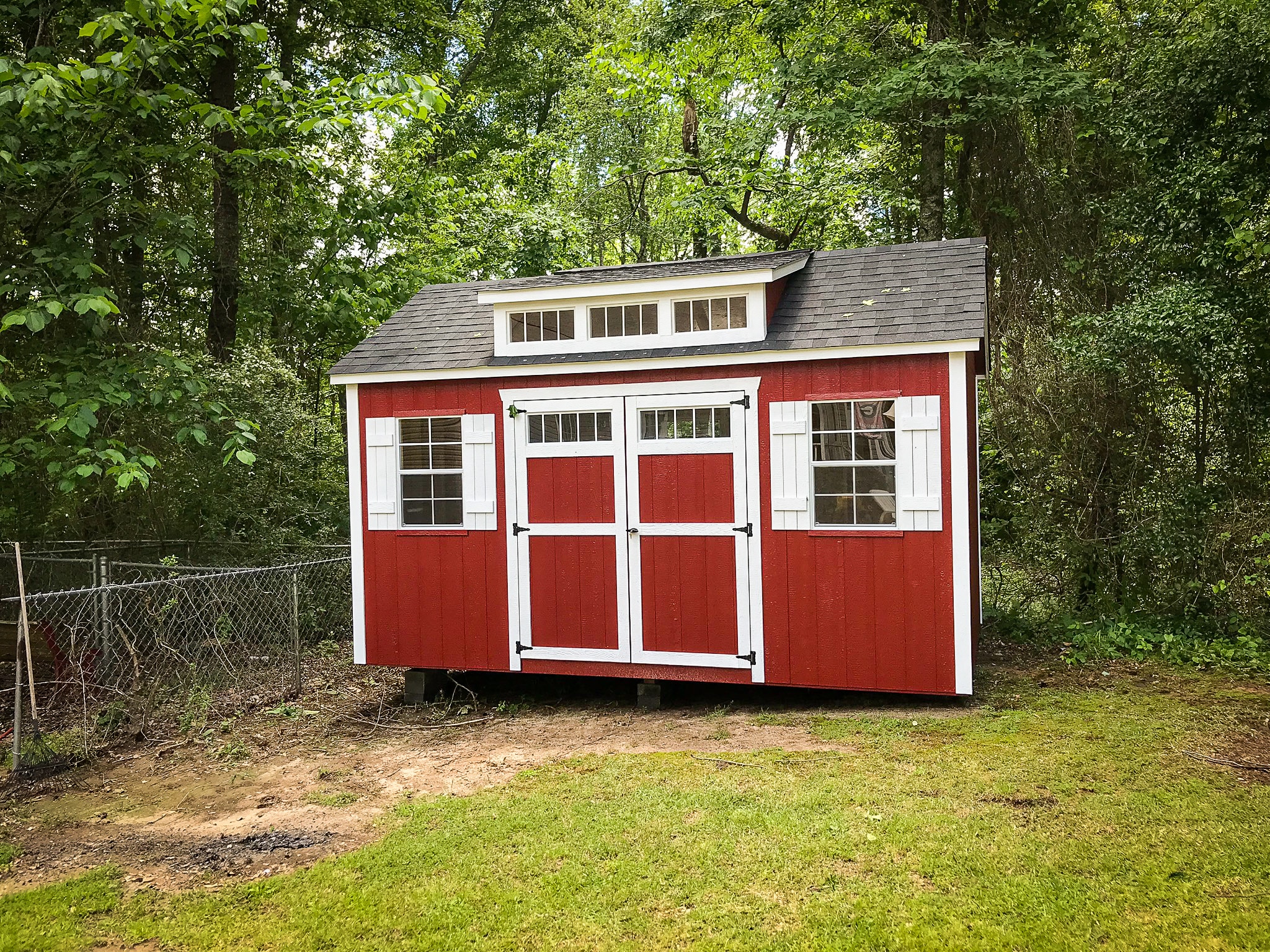 Sheds in Georgia - Red and white shed with white-framed windows and doors